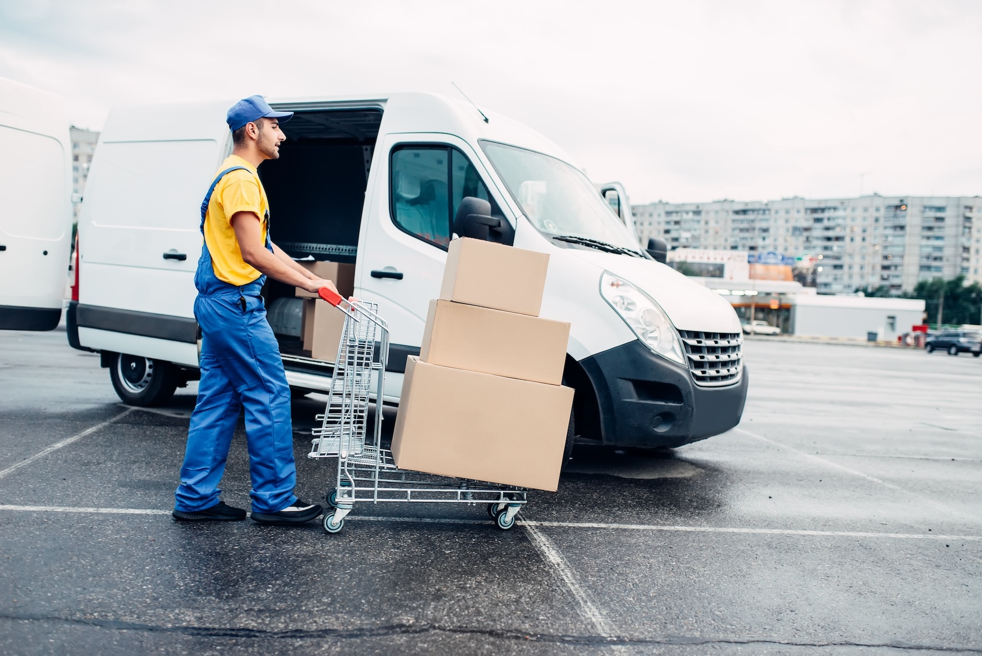Courier loading a logistics truck