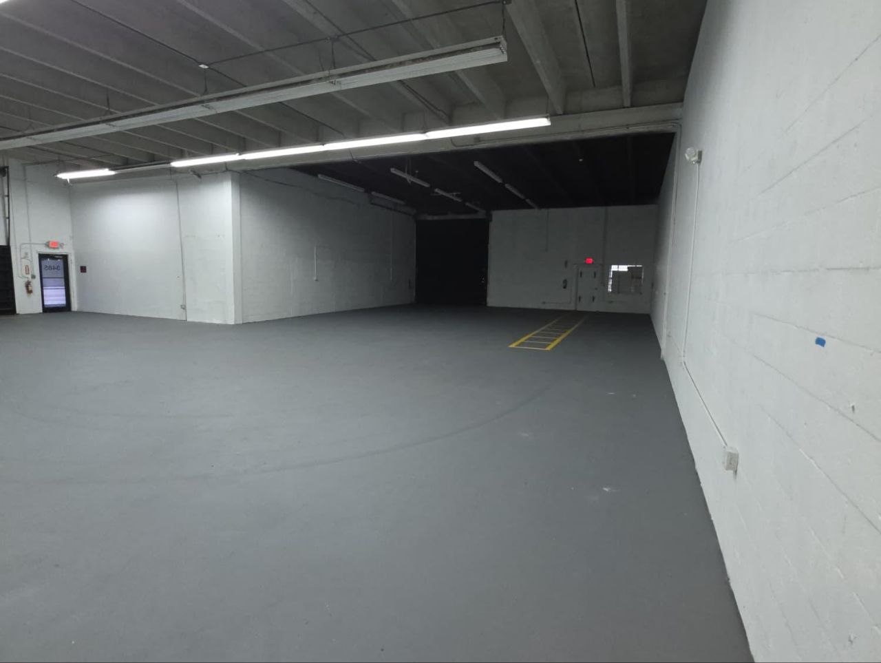 Clean warehouse space with office entrance