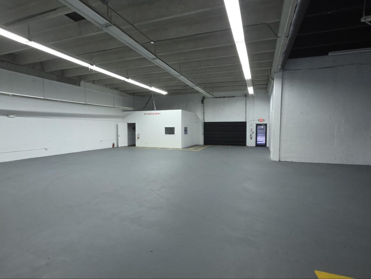 Warehouse with secure roll-up door for storage